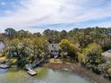 Beautiful waterfront home with a private dock and surrounded by lush trees at 601 Foredeck Ln, Edisto Island, SC 29438