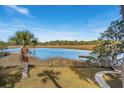 Scenic waterfront view from property showcasing serene inlet and private dock at 601 Foredeck Ln, Edisto Island, SC 29438