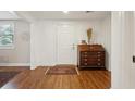 Bright entryway featuring hardwood floors, antique desk, and neutral walls at 728 N Godfrey Park Pl, Charleston, SC 29407