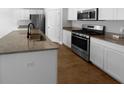 Modern kitchen featuring granite countertops, stainless steel appliances and a central island at 96 Dean Dr, Summerville, SC 29483