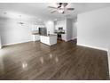 Spacious open-concept living area with hardwood floors flowing into the kitchen at 96 Dean Dr, Summerville, SC 29483