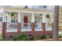 Charming home featuring an inviting front porch, with lush landscaping at 109 White Pine Way, Summerville, SC 29485