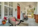 Inviting front porch with comfortable seating and a vibrant red door at 109 White Pine Way, Summerville, SC 29485