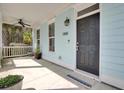 Cozy front porch featuring a ceiling fan and a welcoming entrance door at 1300 Carol Oaks Dr, Mount Pleasant, SC 29466