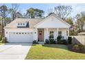 Inviting single-Gathering home with a delightful pink door, well-kept lawn, and a convenient two-car garage at 1403 Thin Pine Dr, Johns Island, SC 29455