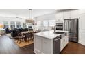 Open-concept kitchen featuring stainless steel appliances, modern countertops, and a seamless flow to the dining area at 1403 Thin Pine Dr, Johns Island, SC 29455