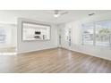Bright living room featuring light wood flooring and an open view to the kitchen at 1412 Sandstone Pl, Charleston, SC 29492