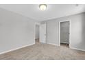 Neutral bedroom features plush carpeting, closet and access to other rooms at 151 Cantona Dr, Summerville, SC 29483
