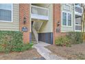 Brick building featuring an inviting entrance with manicured landscaping and charming lighting fixtures at 1600 Long Grove Dr # 1621, Mount Pleasant, SC 29464