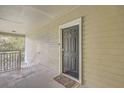 A private entryway featuring a black front door and a covered porch area with a welcome mat at 1600 Long Grove Dr # 1621, Mount Pleasant, SC 29464