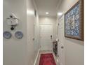 Hallway featuring light walls, hardwood floors, and tasteful decorative elements at 1600 Long Grove Dr # 1621, Mount Pleasant, SC 29464