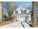 Well-maintained two-story home with a two-car garage and a neatly kept front lawn at 1630 Balsam St, Charleston, SC 29407