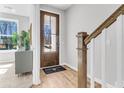 Welcoming foyer features a wood front door with glass, wood floors, and white trim at 171 Cantona Dr, Summerville, SC 29483