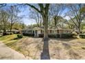 Ranch style home with brick exterior and lush front lawn at 1929 Westminster Rd, Charleston, SC 29407
