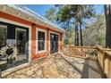 An exterior shot showcases a wooden deck with a door leading inside, surrounded by vibrant trees at 247 Lotz Dr, Summerville, SC 29483