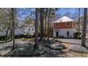 Exterior home view with a well-maintained lawn and trees showcases the home's setting at 247 Lotz Dr, Summerville, SC 29483