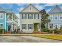 Charming two-story home with inviting front porch and manicured landscaping and adjacent building at 312 White Gables Dr, Summerville, SC 29483