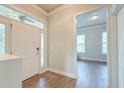Bright foyer with wood-look flooring, white trim, and an open view to the adjacent room at 312 White Gables Dr, Summerville, SC 29483