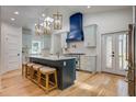 Bright eat-in kitchen with island, pendant lights, modern appliances, and ample storage at 35 Cypress St, Charleston, SC 29403