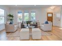 Bright and cozy living room featuring hardwood floors and ample seating at 35 Cypress St, Charleston, SC 29403