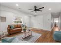 Bright living room features hardwood floors, ceiling fan, and a comfortable seating area at 422 Jean Wells Dr, Goose Creek, SC 29445
