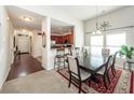 Bright dining area featuring a breakfast bar, stylish table set and open concept design at 613 Zinnia Dr, Goose Creek, SC 29445
