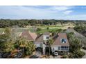 Charming two-story homes with palm trees and golf course views, offering a serene and picturesque setting at 747 Spinnaker Beachhouse, Seabrook Island, SC 29455