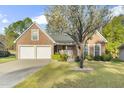 Beautiful brick home with lush green lawn and attractive landscaping, highlighting its curb appeal at 779 Hamlet Cir, Goose Creek, SC 29445