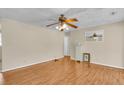 Bright living room featuring hardwood floors, neutral walls, and a classic ceiling fan at 834 Prince John Dr, Charleston, SC 29407