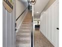 Inviting foyer features stairs and stylish wall trim at 9402 Sweep Dr, Summerville, SC 29485