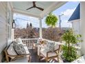 Relaxing porch with comfortable seating and a ceiling fan for warm days at 106 Queen St # B, Charleston, SC 29401