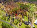 Sprawling property in wooded area featuring home with central courtyard and circular driveway at 1117 Walleye Rd, Bonneau, SC 29431