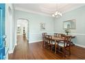 Formal dining room featuring a wooden table with six chairs and a chandelier at 112 Etiwan Park St, Charleston, SC 29492