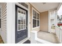 Welcoming front entrance with a black glass-paneled door and white trim at 120 Diploma Dr, Ladson, SC 29456