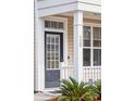 Inviting front entry with a glass-paneled door and manicured plants at 120 Diploma Dr, Ladson, SC 29456