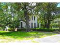 Elegant home with well-manicured lawn and beautiful mature trees at 219 Rigby St, Reevesville, SC 29471