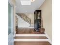 Entryway features hardwood floors and staircase with a modern railing design at 2224 Shoreline Dr, Johns Island, SC 29455