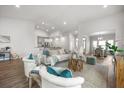 Bright and airy living room with modern decor, a large rug, and plenty of seating at 2620 Private Lefler Dr, Johns Island, SC 29455