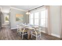 Bright dining room featuring a rustic wood table, stylish chairs, and lots of natural light at 295 Citrus Dr, Summerville, SC 29486