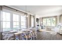 Open-concept living and dining area filled with natural light and modern furnishings at 295 Citrus Dr, Summerville, SC 29486