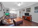 Inviting living room featuring hardwood floors, plush leather seating, and stylish decor at 300 Bucksley Ln # 104, Charleston, SC 29492