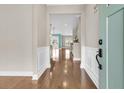 Warm and welcoming foyer with gleaming hardwood floors and a view of the open-concept living space at 418 Eastern Isle Ave, Summerville, SC 29486