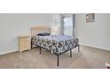Comfortable bedroom with a simple bed frame and a neutral color palette at 446 White Scallop Way, Summerville, SC 29486
