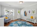Bright foyer features stylish décor, hardwood floors, and a welcoming ambiance at 108 Rose Ln, Mount Pleasant, SC 29464