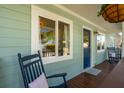 Relaxing front porch with rocking chairs, offering a cozy outdoor space at 108 Rose Ln, Mount Pleasant, SC 29464