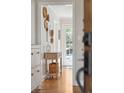 Light-filled foyer with stylish console table and wall decor, leading to a bright entryway at 109 Buckingham Ave, Summerville, SC 29485