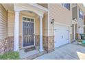 Charming townhome entrance with a black door and brick accents at 118 Lamplighter Ln, Summerville, SC 29486