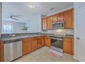 Well-equipped kitchen featuring stainless steel appliances and wood cabinetry at 118 Lamplighter Ln, Summerville, SC 29486