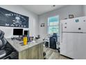 Bright office area featuring a desk, storage, and window, perfect for a productive workspace at 131 Swaying Palm Dr, Summerville, SC 29485