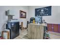 Functional office space with modern desk, storage, and casual decor, ideal for remote work at 131 Swaying Palm Dr, Summerville, SC 29485